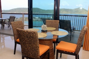 Indoor dining with water and island views.