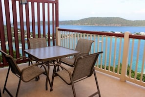 Outdoor dining on covered balcony with gorgeous views.