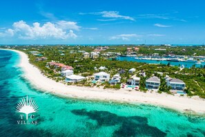 Aerial view of Grace Bay Beach, Turtle Cove, and Coriander Cottage. 