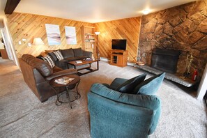 Living Room with Wood Fireplace - Living Room with Wood Fireplace