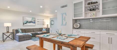 The kitchen and dining area open up to the living area