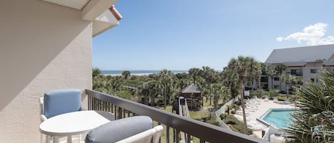 Relax. Unwind. Reset. - The balcony of Ocean Village Club Q36 makes the perfect place to relax after a day on the beach.