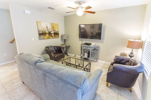 Gather in the lovely living room of unit A for movie night! - Pop a few bowls of popcorn, put a movie in, and settle in for a fun family night. The flat-screen TV keeps the group entertained any time of year!