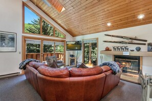 The living room has a wood burning fireplace, 46" flat screen TV, BluRay 3D DVD and plenty of family movies to chooses from.