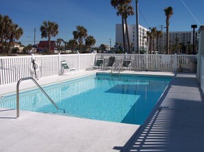 Pool - The fenced-in pool is located in front of the building's parking area.  A small building next to it houses convenient bathrooms.