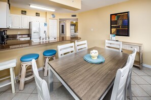 Dining Area - Seating for 6 at the dining table with additional seating at the kitchen island.