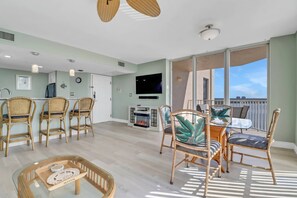 Enjoy watching television programming on the large flat screen TV with cable in the main living area.