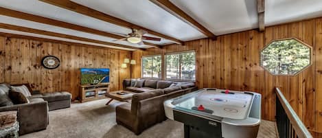 This home is ideal for families with kids (or kids at heart) with a game room upstairs, air-hockey table, and HDTV!