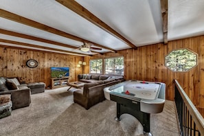 This home is ideal for families with kids (or kids at heart) with a game room upstairs, air-hockey table, and HDTV!