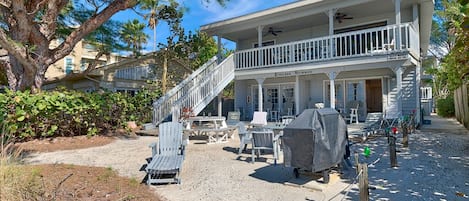 Endless Summer B - Beach Side of the Back of the Building.  Plenty of lounge chairs, 2 picnic tables, gas Grill.  Ground Floor 1 Bedroom on the south side