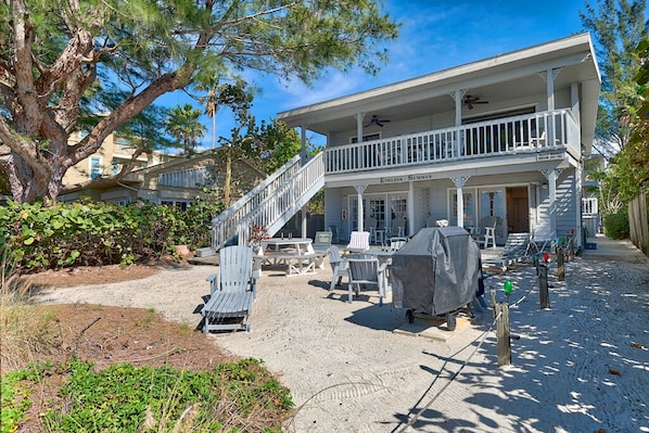 Endless Summer B - Beach Side of the Back of the Building.  Plenty of lounge chairs, 2 picnic tables, gas Grill.  Ground Floor 1 Bedroom on the south side