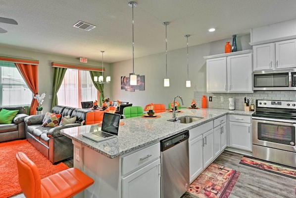 This modern kitchen comes fully equipped with new stainless steel appliances.