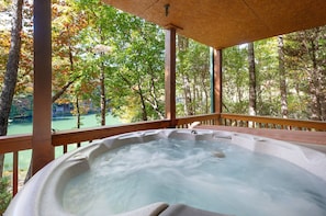 Soak in the hot tub with a gorgeous view of Cherry Lake as a backdrop
