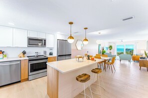 A beautifully upgraded kitchen and dining space with modern amenities and style