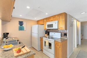 Brew fresh coffee, and whip up a seaside breakfast in this bright, fully equipped kitchen!