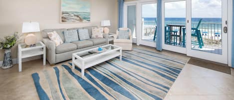 Comfortable seating and beautiful accents. - This gulf front living room truly embodies the ideal place to unwind!