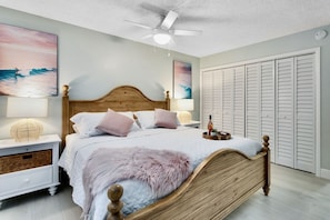 Master bedroom with a king bed and TV.