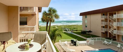 Enjoy your sun exposed balcony with views of the pool and ocean.