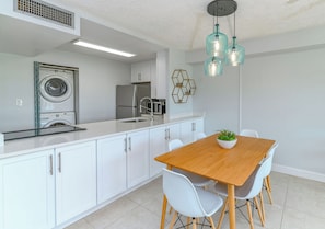 Modern, stylish, and functional—gather for meals under chic lighting, with every convenience at hand!