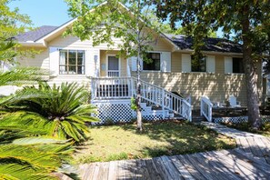 Walk up the wooden path, make your way up the steps and enter the front door to this relaxing retreat.