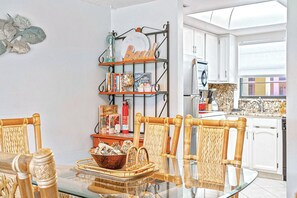 Charming dining area with tropical accents, perfect for enjoying meals together.