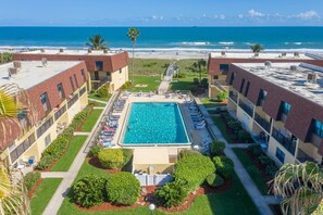 Breathtaking oceanfront pool view, just steps from the beach for ultimate relaxation.