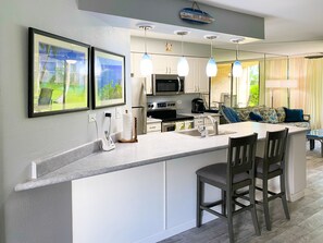 Eat breakfast at the bar or at the dining table.