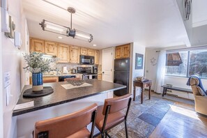 This home has a freshly updated kitchen with a brand new breakfast bar, lighting and comfortable dining stools. Natural light fills this bright and ch