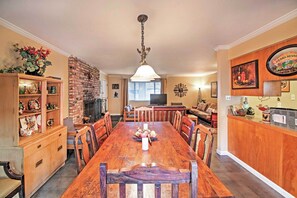 Wine and dine at this large dining table.