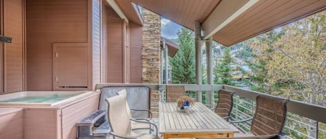 Just off the living room is one of the two private patios, this is the larger of the two with a private hot tub, dining table, gas grill and