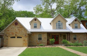 Guest entrance is just to the right of the red door. *** Note: This is a guest suite and not the entire house. The owners live onsite.**