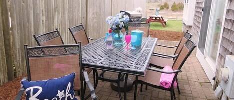 Another dining set is located on the patio with easy access to the kitchen through the sliders -  15 Oyster Drive- Chatham- Cape Cod -New England Vacation Rentals