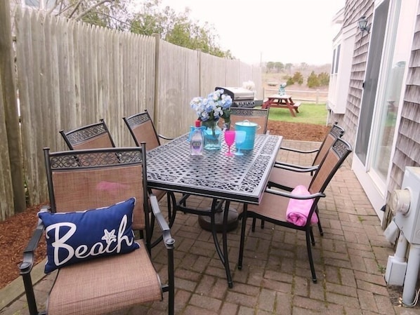 Another dining set is located on the patio with easy access to the kitchen through the sliders -  15 Oyster Drive- Chatham- Cape Cod -New England Vacation Rentals