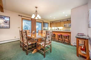 Dining room with seating for 6, breakfast bar with seating for 3 and deck access to the golf course.