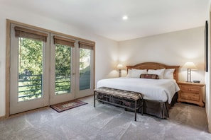 Master bedroom with king bed and en suite bathroom.