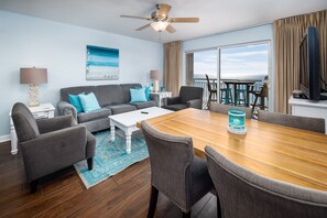 Dining and living room area - Enjoy these areas with a splash of beachy theme.   Not to mention that view......