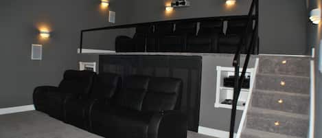 IMAX Style Theater - One of a Kind Movie Theater themed after an IMAX.  Seating for 5 on front row, and make your way upstairs to the back row sitting 5 feet in the air with seating for 5.  An explosive 7.1 surround sound on a massive 150 inch screen.