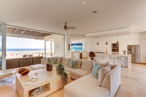 The living room space has the capability for indoor/outdoor living.