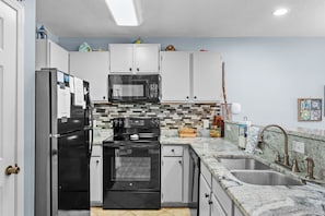 Kitchen Open to Dining and Living Areas