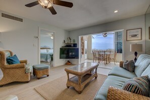 Living room with tropical furniture & sofa bed