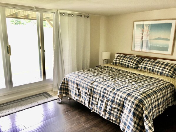 Lower level king bed with slider door to patio - Lower level king bed with slider door to patio