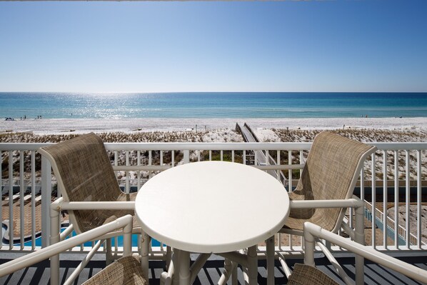 Balcony view - Patio furniture for four plus additional seating on the sides.
