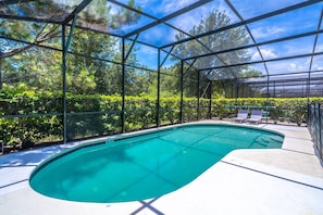 Large private pool with safety fence and plenty of lounge seating