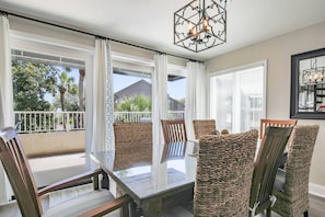 The Magnolia is a 3-story, end unit villa steps from the beach.