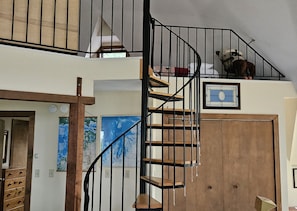 Spiral staircase to upstairs. - Spiral staircase to upstairs.