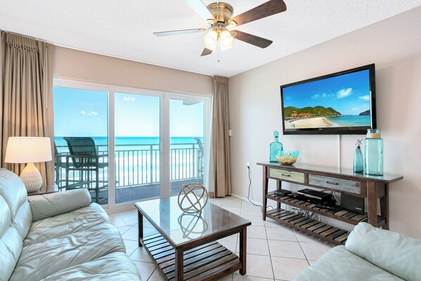 Relax in this airy ocean view living space where the waves are just a glance away