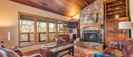 Private Deck, Natural lighting and panoramic views invite family and friends to gather in the living area.