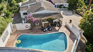 Casa da Figueira's large heated private pool, with shady patio ideal for lunch. 