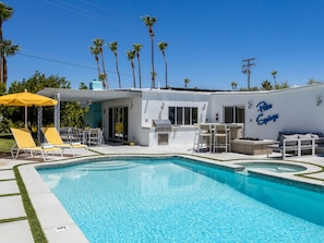 Resort-style yard made for relaxing in the sun