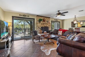 Cozy living area with picturesque sliding glass doors to the outside